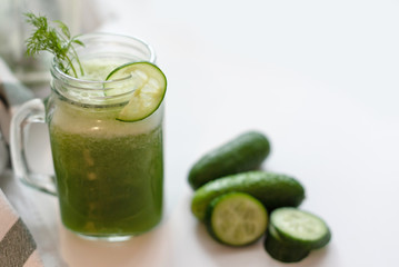 the process of making fresh juice or cucumber smoothies, detox smoothies and juices, weight loss diet