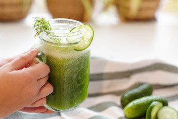 the process of making fresh juice or cucumber smoothies, detox smoothies and juices, weight loss diet
