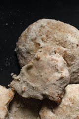 Pastries with powdered sugar and dark background. Typical spanish Christmas sweets.