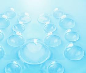 soap bubble on blue background. foam bubbles abstract backdrop. concept of pure, cleanliness and cleaning products. macro. 