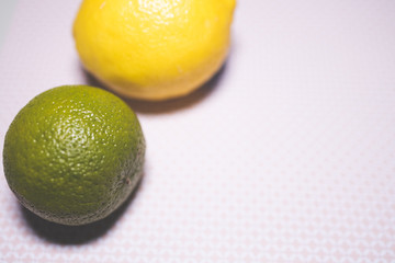 lime and lemon fruit on background