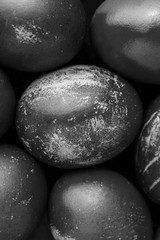 Easter eggs painted in monochrome black and white style close up, with stains, scuffs, scratches. handmade painted eggs. Flat lay