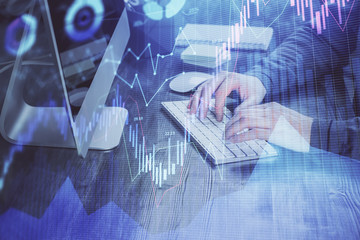 Double exposure of financial graph with man works in office on background. Concept of analysis.