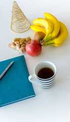 New Year's Resolutions for the New Year 2020, Notebook with Ready Pen, New Goals and Commitments and Promises, Christmas Holiday Decorations, Warm Tea and New Year Events, Golden Tree