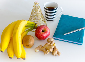 New Year's Resolutions for the New Year 2020, Notebook with Ready Pen, New Goals and Commitments and Promises, Christmas Holiday Decorations, Warm Tea and New Year Events, Golden Tree © Martin