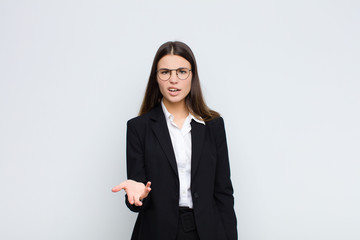 young businesswoman looking angry, annoyed and frustrated screaming wtf or what‚Äôs wrong with...