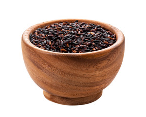 Black rice in wooden bowl isolated on white background