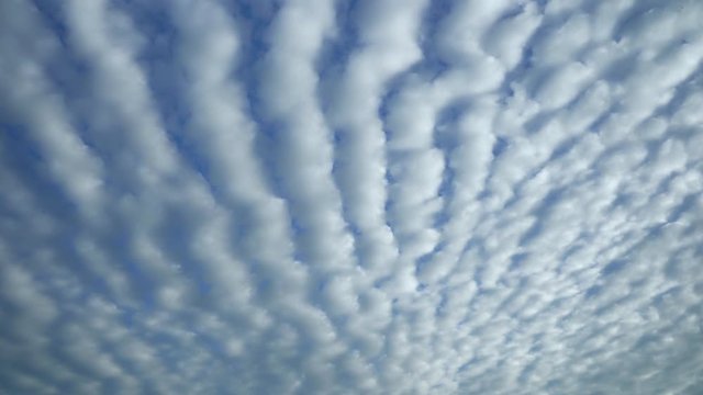 Beautiful sky with clouds background fast motion time lapse puffy lightness weather, formation white cloudy sky on a winter cold day