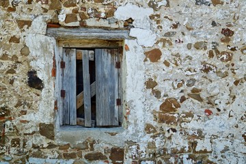 window on the old facade of the house in the street in Bilbao city Spain
