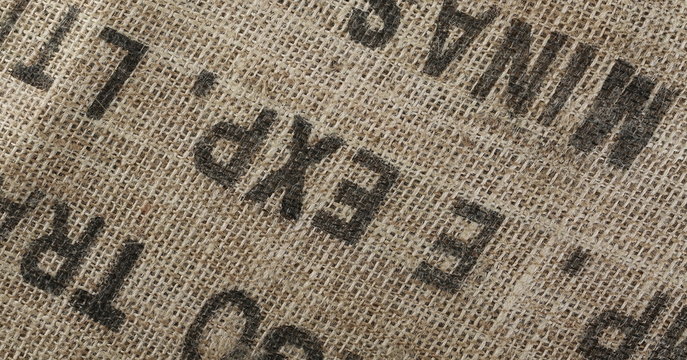 Jute, linen surface with printed words and numbers background and texture