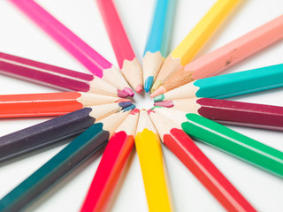 Fototapeta premium various colors of pencils on a white background, copy space
