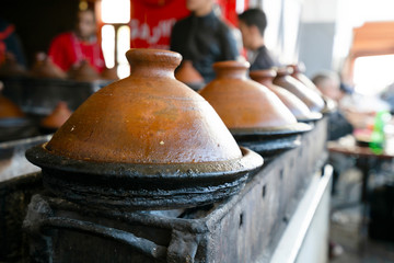 Delicious Moroccan tajine prepared and served in clay pots