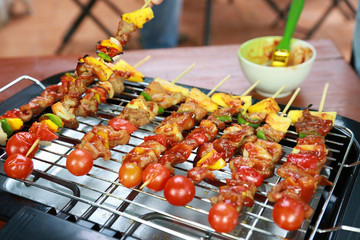 Barbeque Grill Street Food in thailand,Eat outdoors in a happy family.