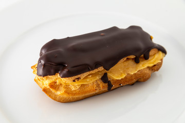 Chocolate covered cake and cream filling