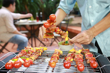 Barbeque Grill Street Food in thailand,Eat outdoors in a happy family.
