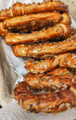 Delicious fresh pretzels with sesame seeds put in a basket
