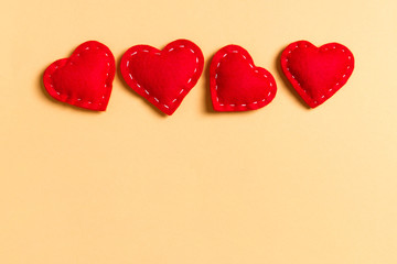 Top view of textile hearts on colorful background. Valentine's day concept with copy space