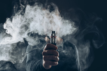 Vaping e-liquid from an electronic cigarette - Powered by Adobe