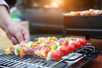 Barbeque Grill Street Food in thailand,Eat outdoors in a happy family.
