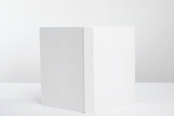 Book with blank cover on white background