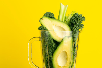 Smoothie recipe. Green smoothie of vegetables (avocado, celery, cale salad, spinach) in a blender...