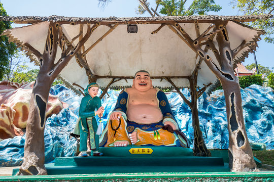 Giant Smiling Buddha statue at Haw Par Villa Theme Park. This park has statues and dioramas scenes from Chinese mythology, folklore, legends, and history.