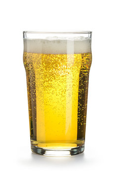Light cold beer in a nonic pint glass with foam and bubbles, isolated on a white background. Vertical image.