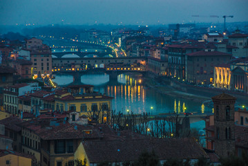 Florence Ponte Vecchio Bridge and City Skyline in Italy.