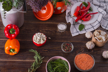 Various herbs and spices on wooden table. Cereals, spices, vegetables and herbs. Balanced diet concept.