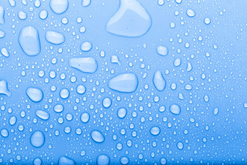 Drops of water on a color background. Selective focus. Blue. Toned