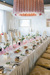 Beautiful festive Banquet wedding table with bouquets of white eustoma