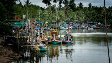 Thai fishing boats tied up to each other in the harbor of Ben Krut