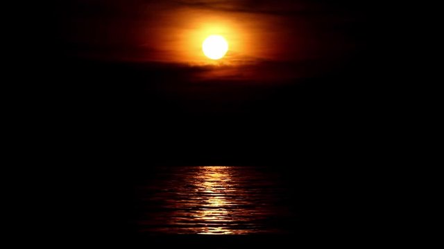Red sunset over the waves of sea.