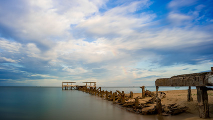 Dilapidated old fishing dock collapsing into the sea in Pak Nam Pran Thailand