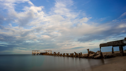 Dilapidated old fishing dock collapsing into the sea in Pak Nam Pran Thailand