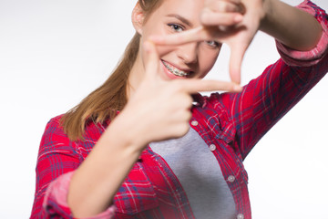 Portrait of teen girl showing dental braces.