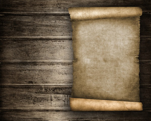 Old scroll paper on wood plank