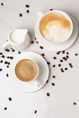different types of coffee on a white background top view and coffee beans