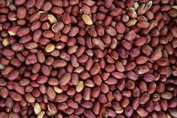 freshly roasted salted peanuts background