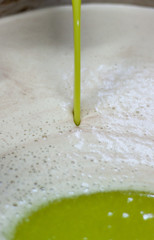 Making of extra virgin olive oil. extraction og oil from olives in a little factory