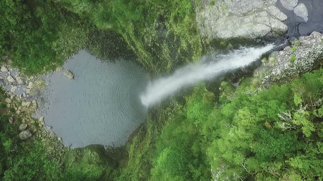 Aerial drone view of "Lagoa do Vento" waterfall in "Paul da Serra", Madeira island, Portugal