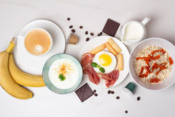 healthy breakfast concept: porridge, coffee, fruits, eggs