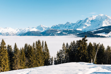 the valley at Sallanches covered with fog on a sunny bright day in the French Mont Blanc massive