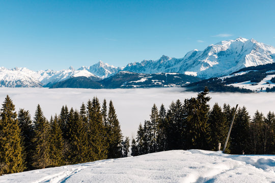 the valley at Sallanches covered with fog on a sunny bright day in the French Mont Blanc massive