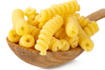 fusilli corti raw pasta isolated on white