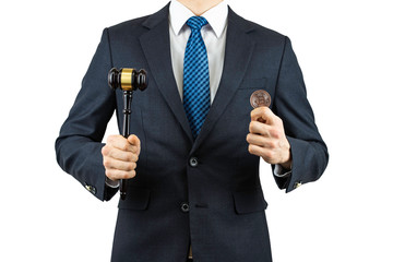 A person wearing a suit and holding a bitcoin in his hand.