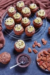 Chocolate cupcakes on a metal rack, top view