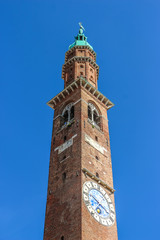 Vicenza, Italy. View of clock tower (Torre Bissara) at famous square (Piazza dei Signori) in Vicenza.