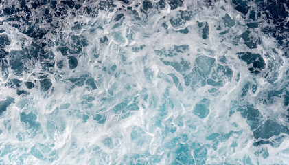 Sea foam moving in the ocean
