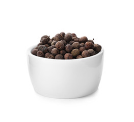 Black pepper in bowl isolated on white